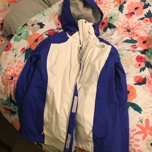 Blue and white North Face rain coat